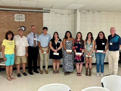 Scholarship Committee Members Marilyn Mrozek and Heath Whittle with NSFA President Sean Person; scholarship recipients Brady Steffen, Abi Fiske, Ruby Shaw, Makayla Parkerson, Elizabeth Killmeyer and Emilia Dupee; and Scholarship Chair Joe Wise. Photo courtesy NSFA